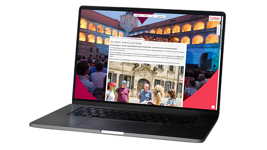 Ein Laptop zeigt eine Webseite mit Informationen zu Konzerten, Events und Festen in Franken.