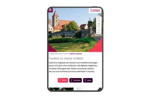 Historische Brücke und Gebäude in Franken auf einer Webseite zu digitalen Angeboten und Freizeitaktivitäten